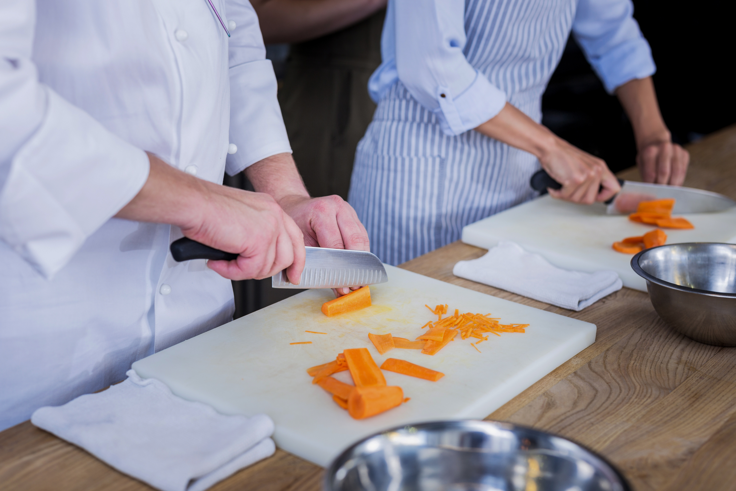 Confident cooks preparing a delicious dish for guests