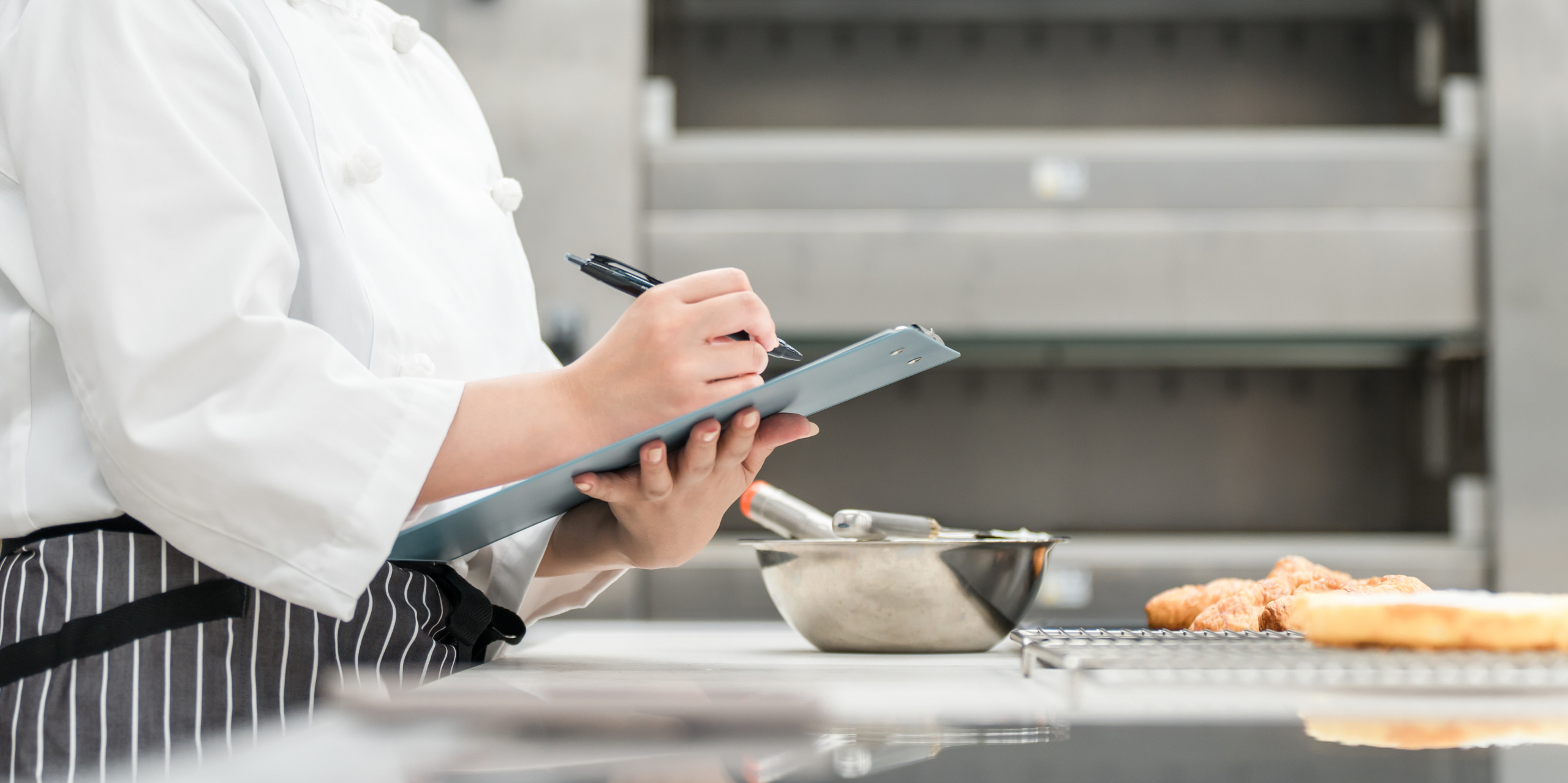 Female staff in the kitchen who check, research, develop products, manage hygiene and quality control for bread.